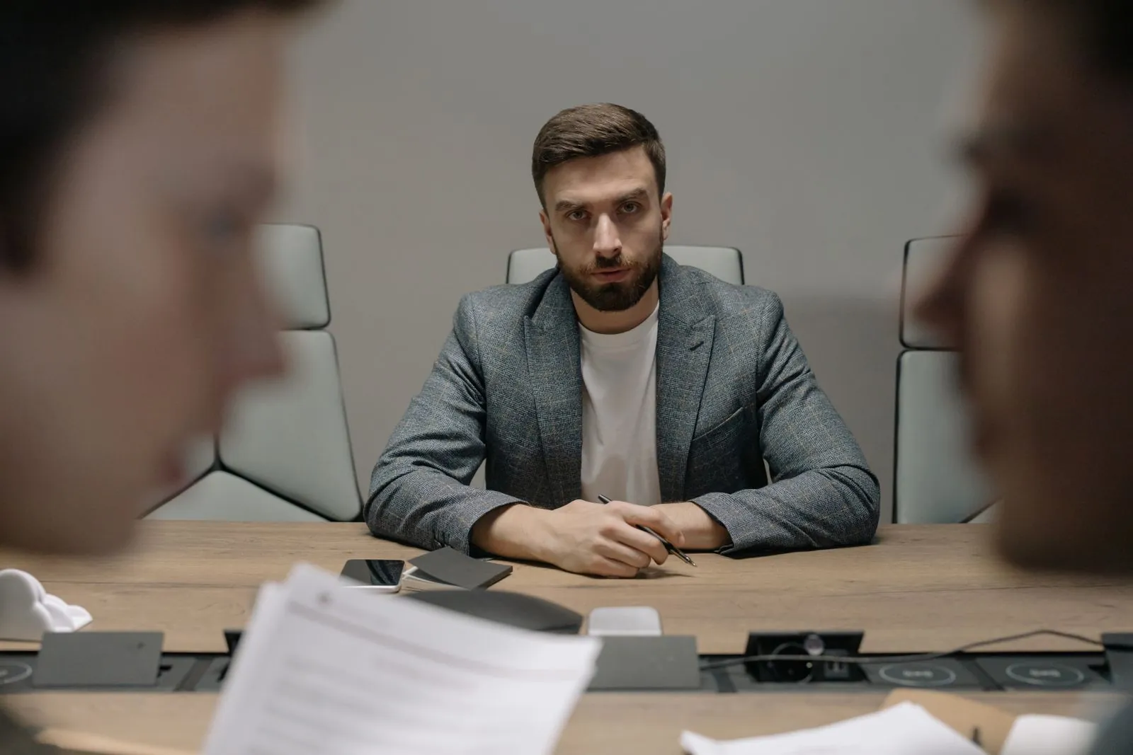 Business owners in a formal meeting around a conference table